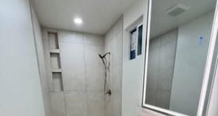 Finished walk-in shower with custom tile