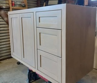 Custom bathroom vanity cabinet with stone top